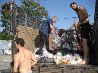 Loading supplies on the truck with the help from students of Grace International School