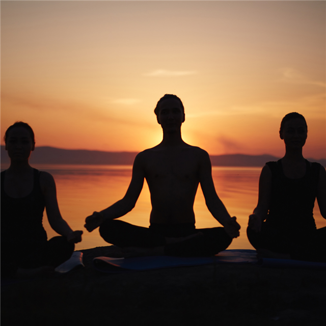 A photo of people meditating.