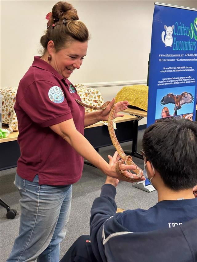 A photo of Andrea from Critter Encounters.