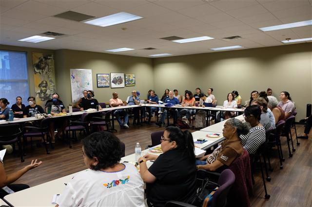 Photograph of a mural titled “The Sisterhood of Two Hearts” displayed on the exterior wall of Mexic-Arte Museum. The artwork features vibrant, colorful depictions of cultural unity between Austin, Texas, and Saltillo, Mexico. Artists: Ana Sofia and Chous. Photo by Lori Renteria. Text overlay says “The Creative Reset” with a City of Austin seal.