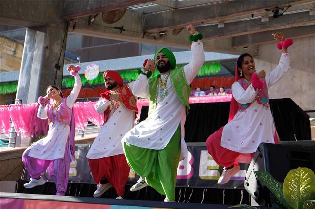 Photograph of a mural titled “The Sisterhood of Two Hearts” displayed on the exterior wall of Mexic-Arte Museum. The artwork features vibrant, colorful depictions of cultural unity between Austin, Texas, and Saltillo, Mexico. Artists: Ana Sofia and Chous. Photo by Lori Renteria. Text overlay says “The Creative Reset” with a City of Austin seal.