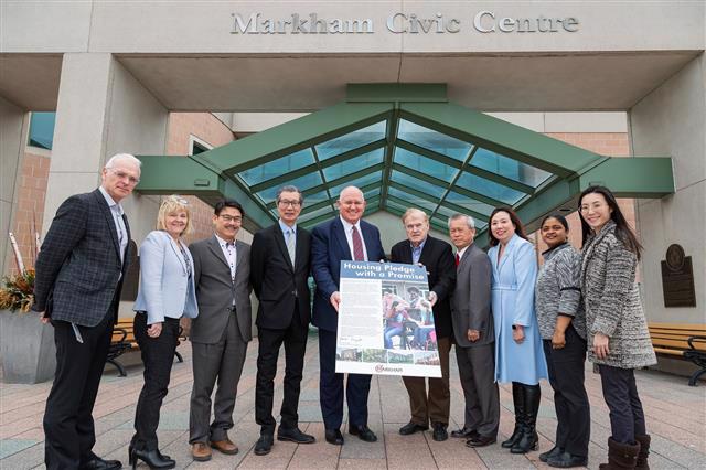 Mayor Frank Scarpitti and Members of Council with Markham’s Housing Pledge outside Markham Civic Centre.