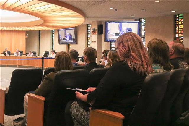 A sideview of a full audience is shown in the Kalamazoo County Board Chambers at the May 16 Board of Commissioners meeting.