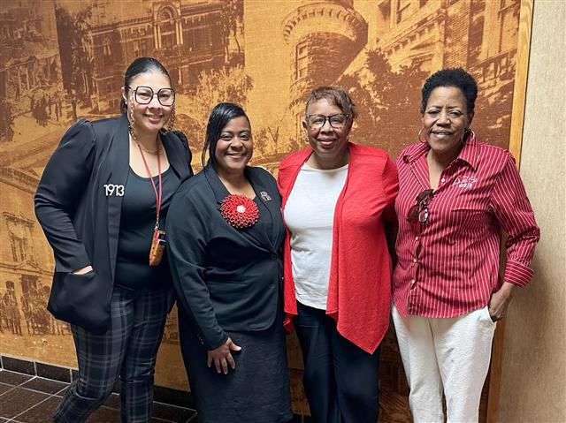 Commissioner Monteze Morales and members of Delta Sigma Theta Sorority Incorporated outside the Board Chambers.