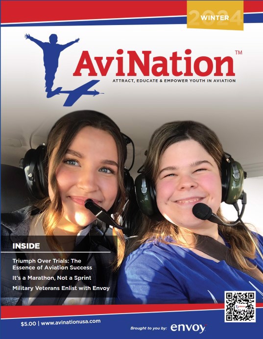 Cover of magazine, 2 young ladies in cockpit of plane wearing headsets