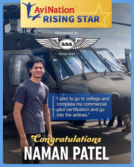 Young man standing in front of a helicopter