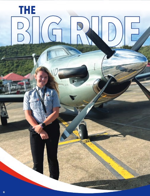Young woman standing next to propeller of midsize aircraft