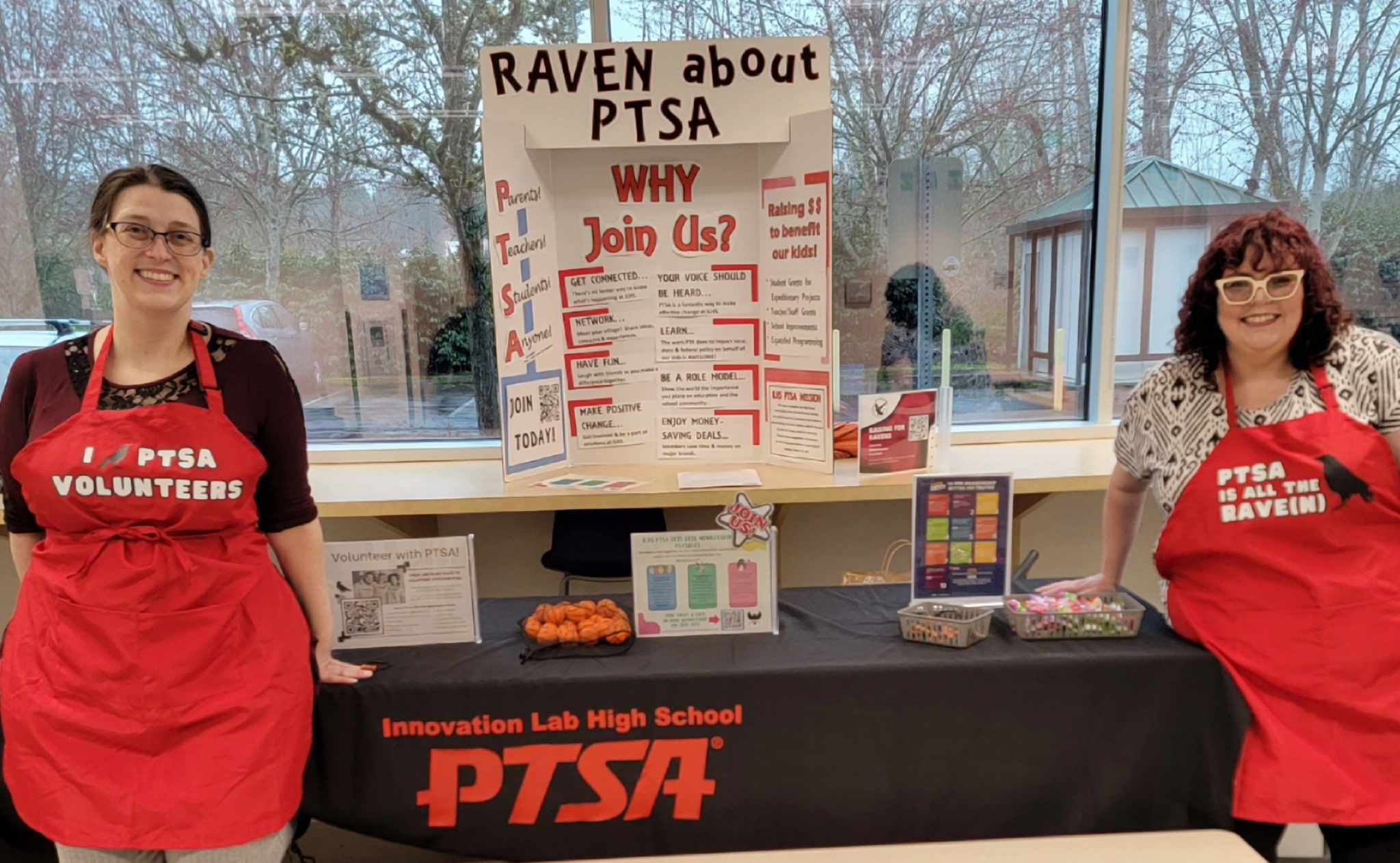 Rachel and Liz at March Madness welcoming new and interested families to ILHS. 
