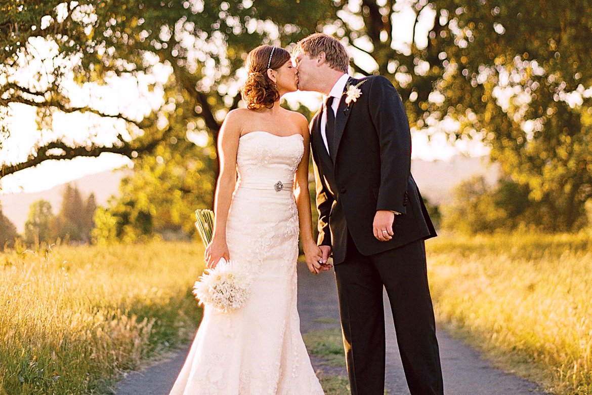 bride and groom kiss