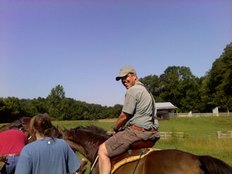 Young man riding horse