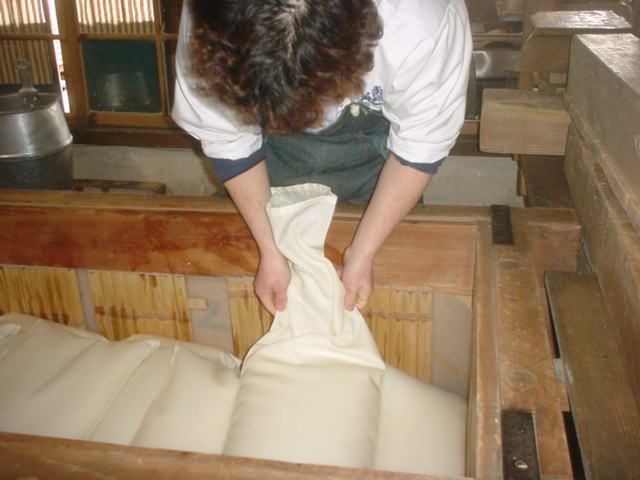 laying bags of mash into the 