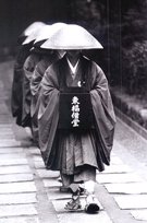 Buddhist Monks Moving Through the Streets