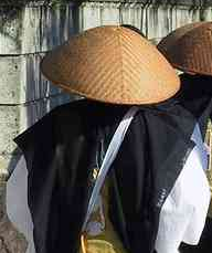 The distinctive hat of a Buddhist monk begging for alms