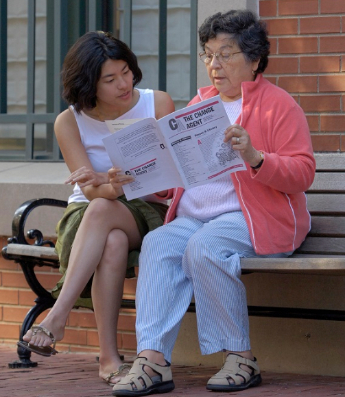 two people reading The Change Agent
