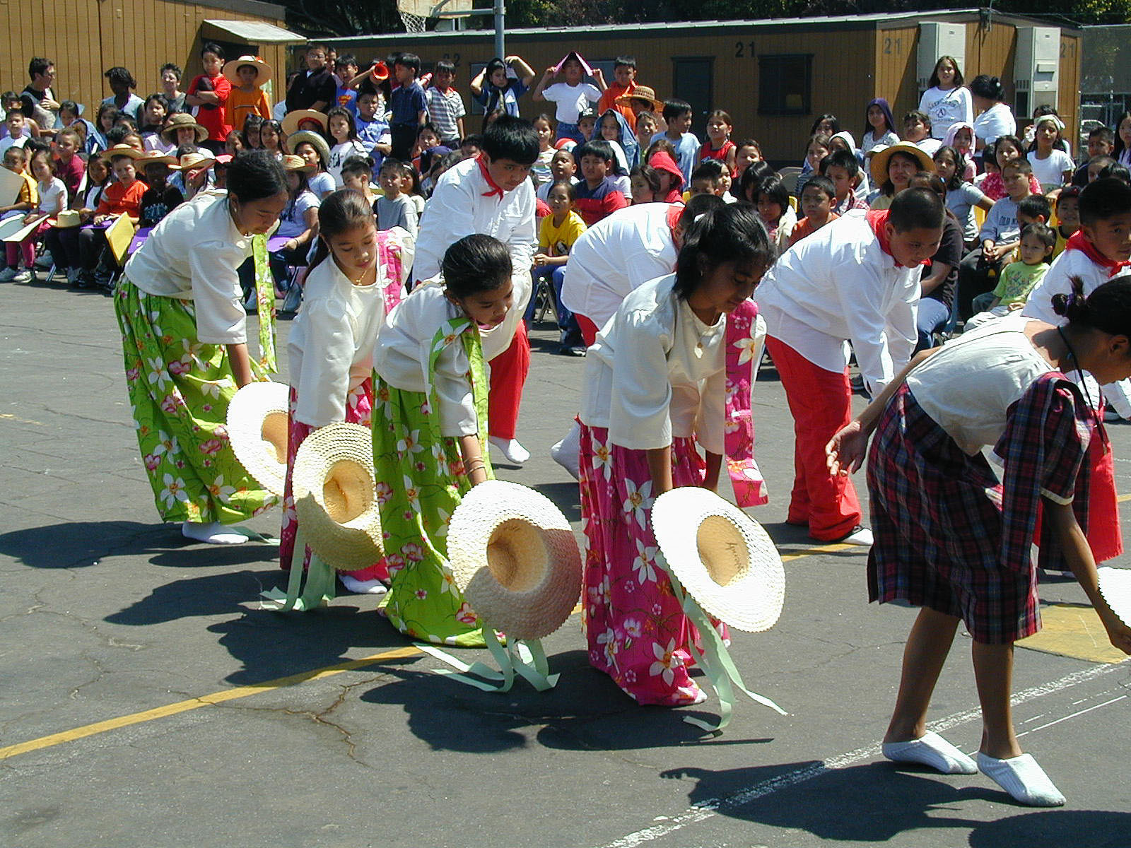 Students participate in a Filipino Hat Dance