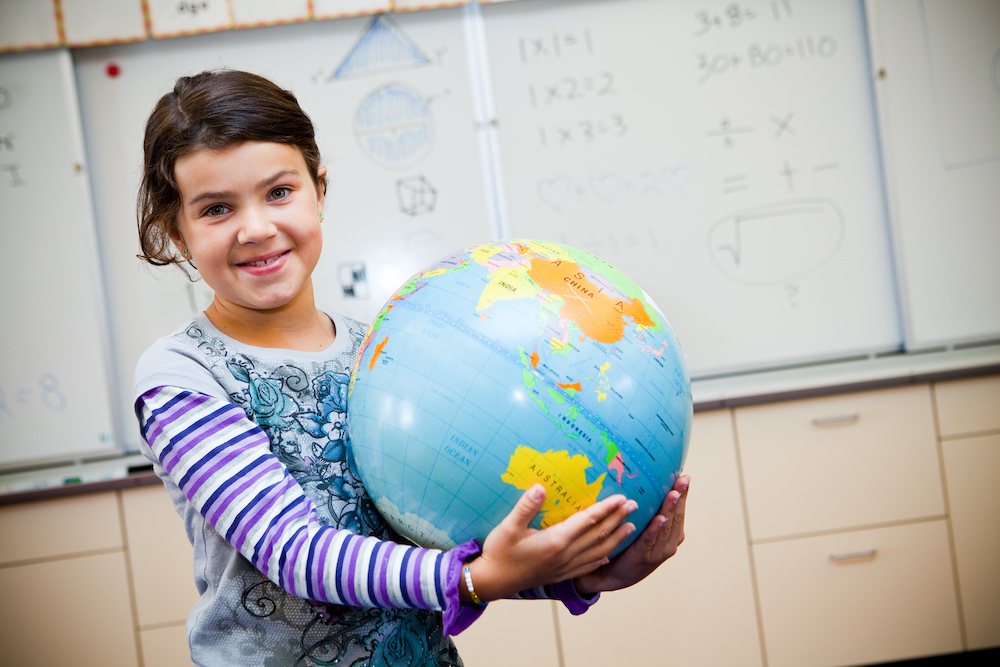 Student with a globe