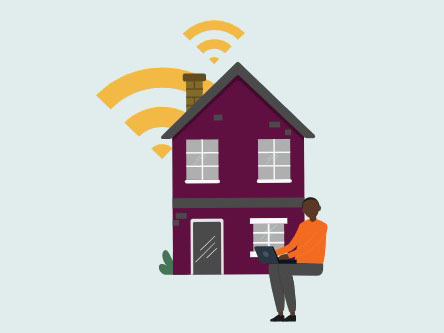 Person with a laptop in front of a house with wireless signlas