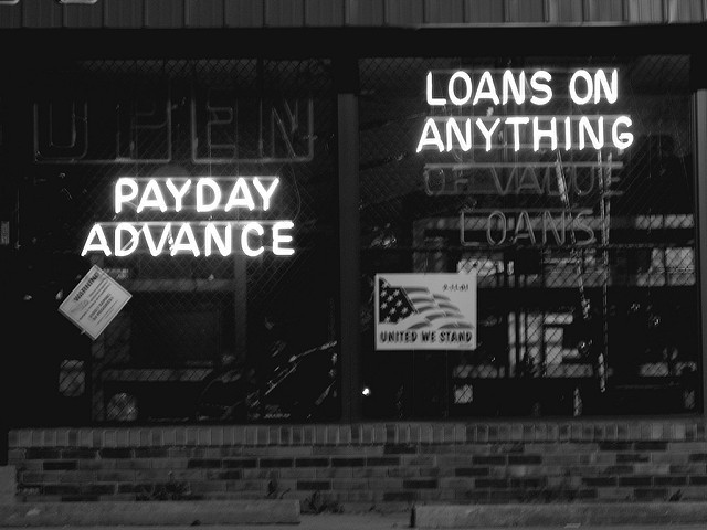 Grayscale photo of a payday lending storefront