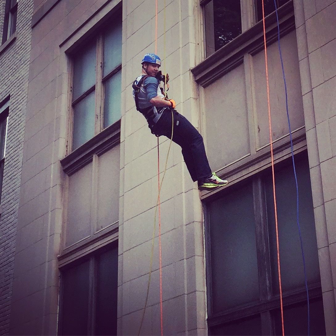 Man scaling the side of a building.