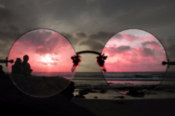 Sunglasses looking over a beach