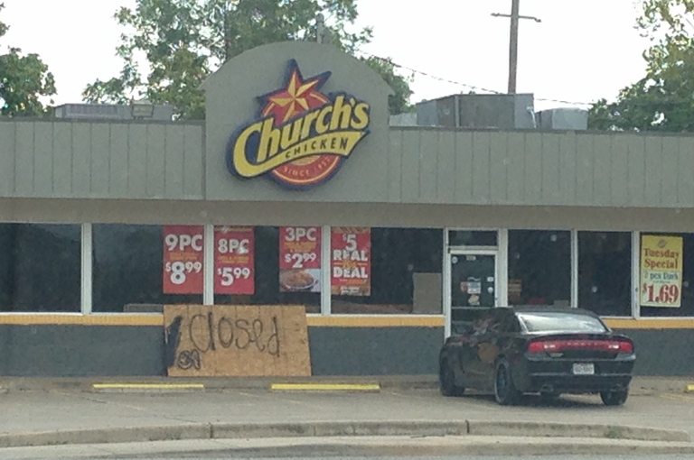 A closed storefront for Church's chicken