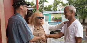 NeighborWorks network members shake the hand of a Puerto Rican resident