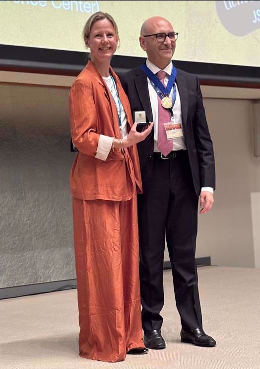 Martin Garset-Zamani, receiving his prize from EFUMB President, Caroline Ewertsen