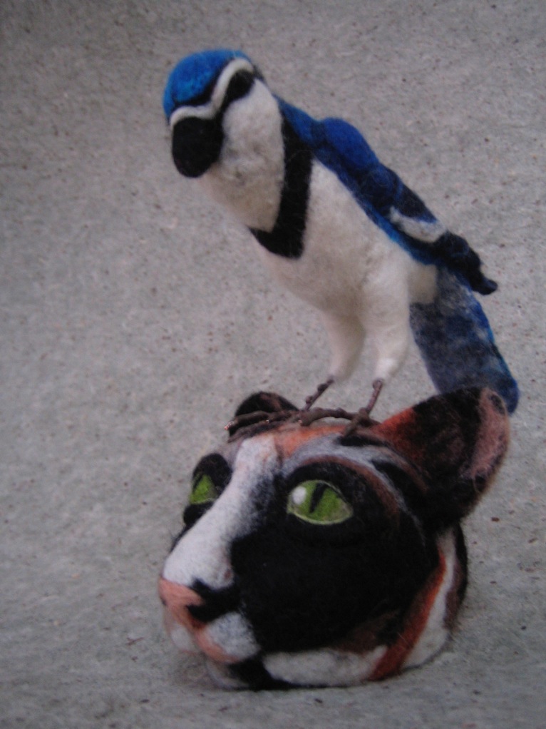 felted callico cat head with Blue Jay.