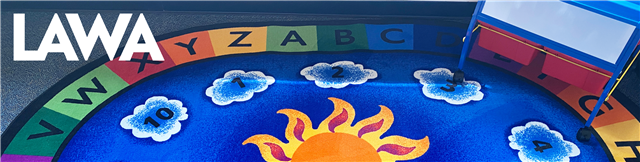 Banner image of a multicolored carpet, woven with a sun in the center, circled by the alphabet and numbers in concentric circles. The acronym LAWA is positioned in the upper left.