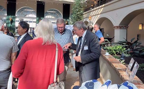 Community Relations Member Charles Pannunzio discusses the ATMP project with a chamber member.
