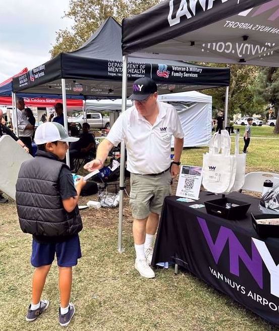 ">Jazz Festival visitors gather for LAWA Giveaways.</div>