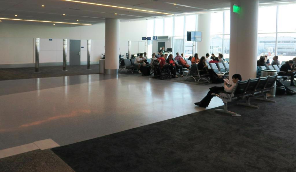 People sitting and waiting at Gate 12A